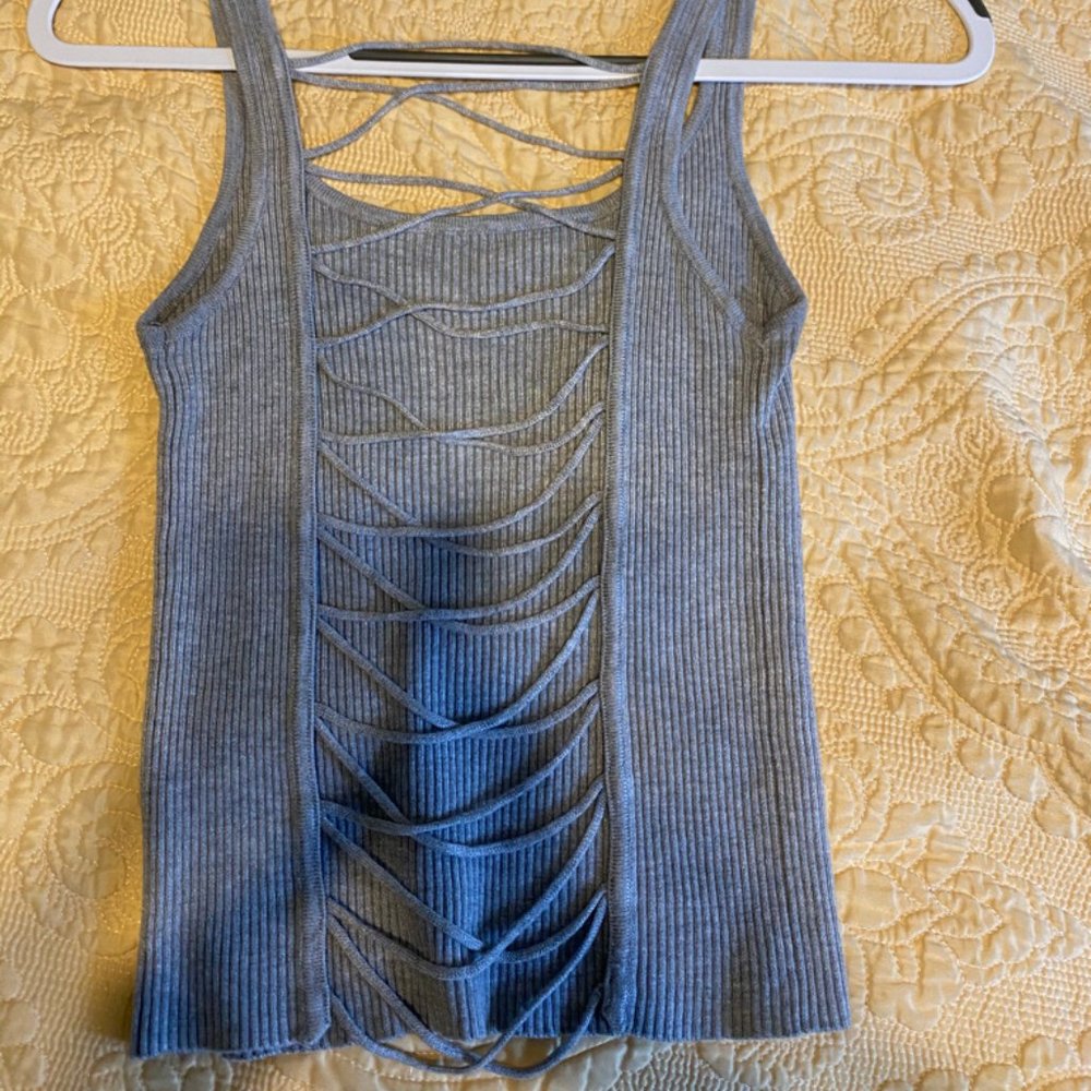 Grey colored tank with open back
